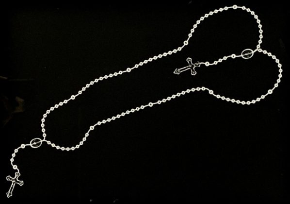 Third of the work "Drawing with rosaries" by Márcia X where the artist draws a series of phalluses using Catholic rosaries