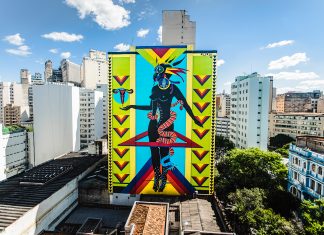 Graffiti mural, made by artist Criola, represents symbols of Afro-Brazilian culture