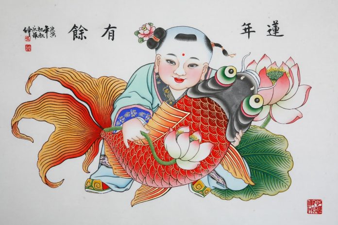 Lunar New Year. Wood painting by Feng Qingju. The work adopts woodcut and hand painting techniques. The theme of the child holding the carp conveys wishes for good fortune, happiness and a long life. Photo: China Intangible Heritage Industry Alliance / Google Arts & Culture collection.